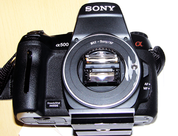 Picture of Fotodiox adapter on Sony camera after grinding it to fit.